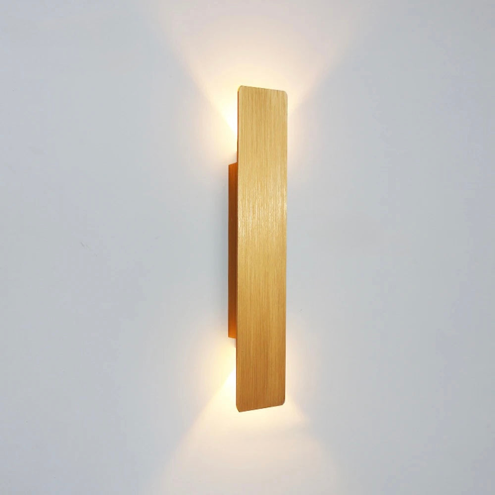 Gold 18W aluminium wall lamp with sleek architectural form and warm light effect