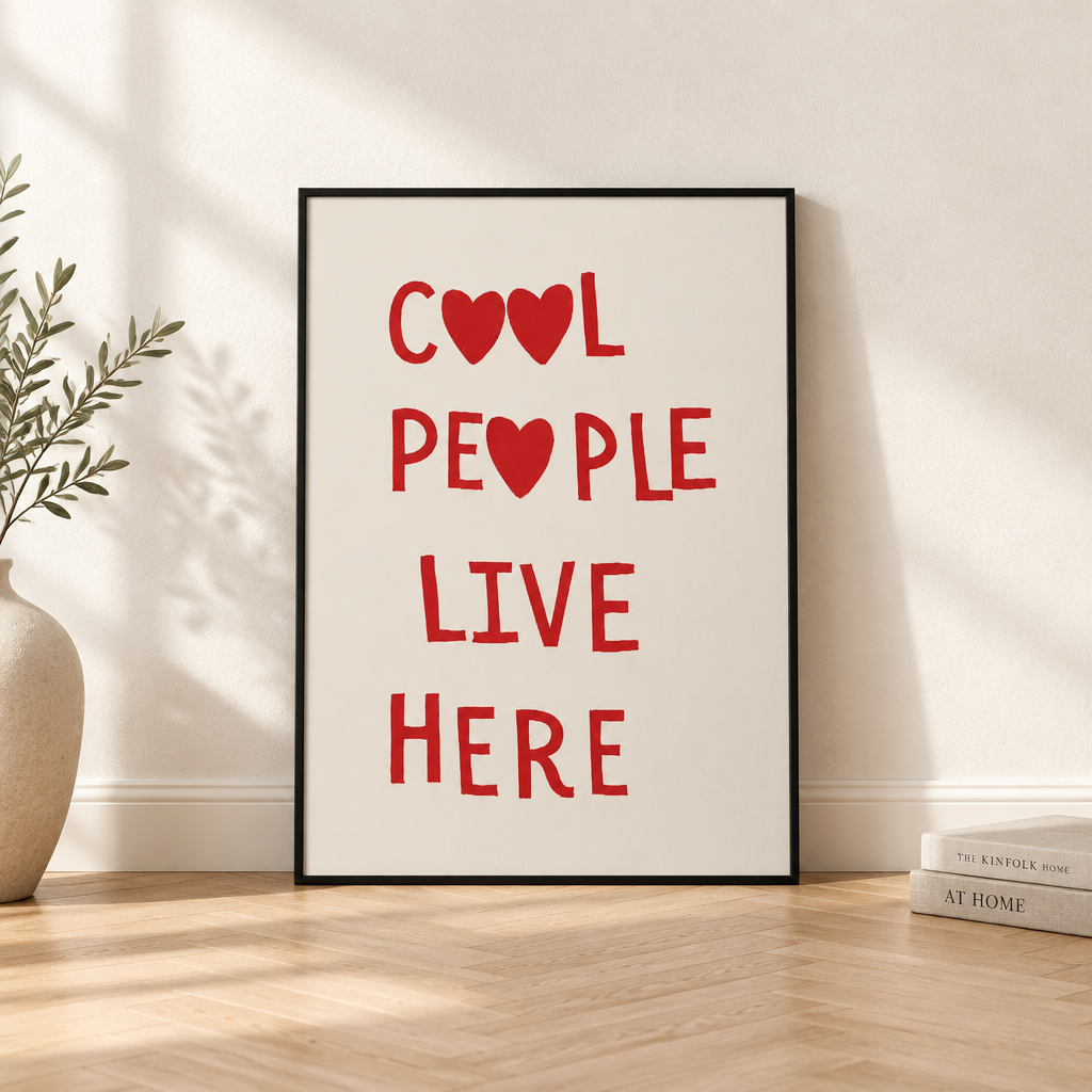 Cool People Live Here: "Cool People Live Here" red quote print in a black frame