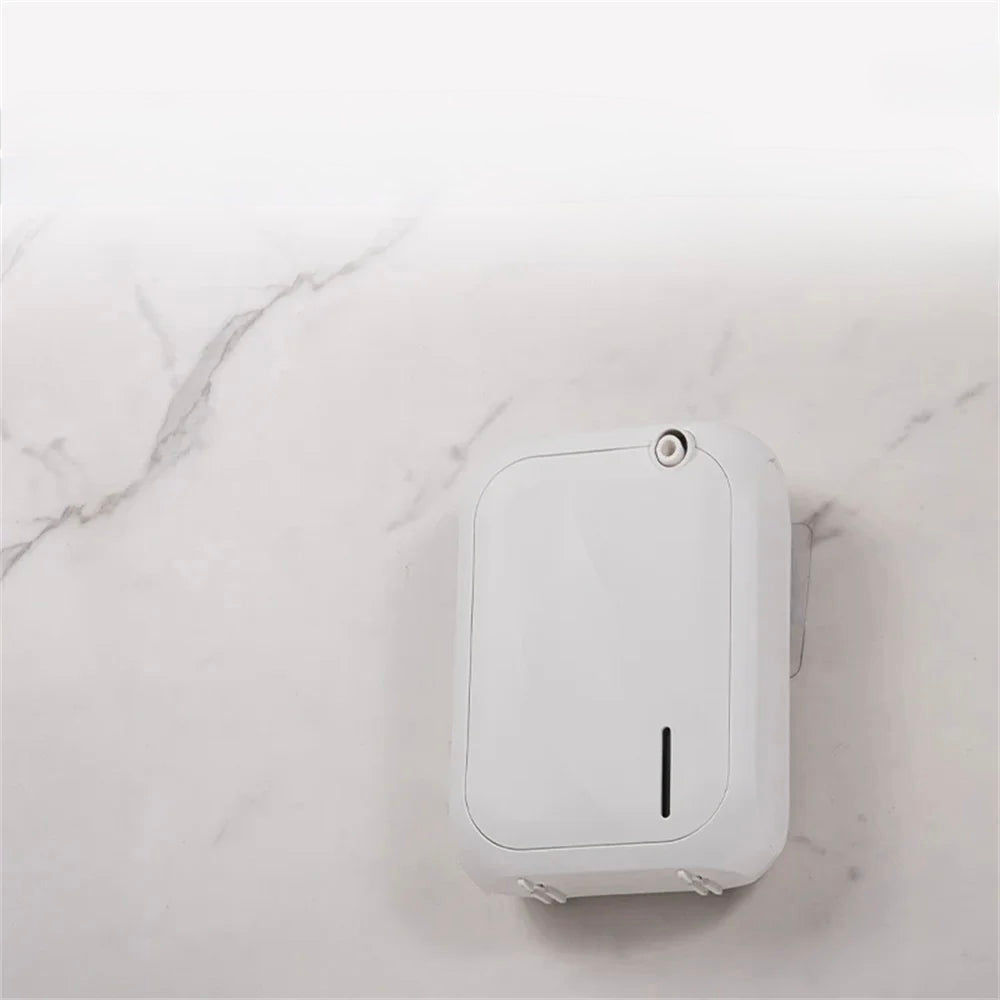 White electronic device on a marble wall surface