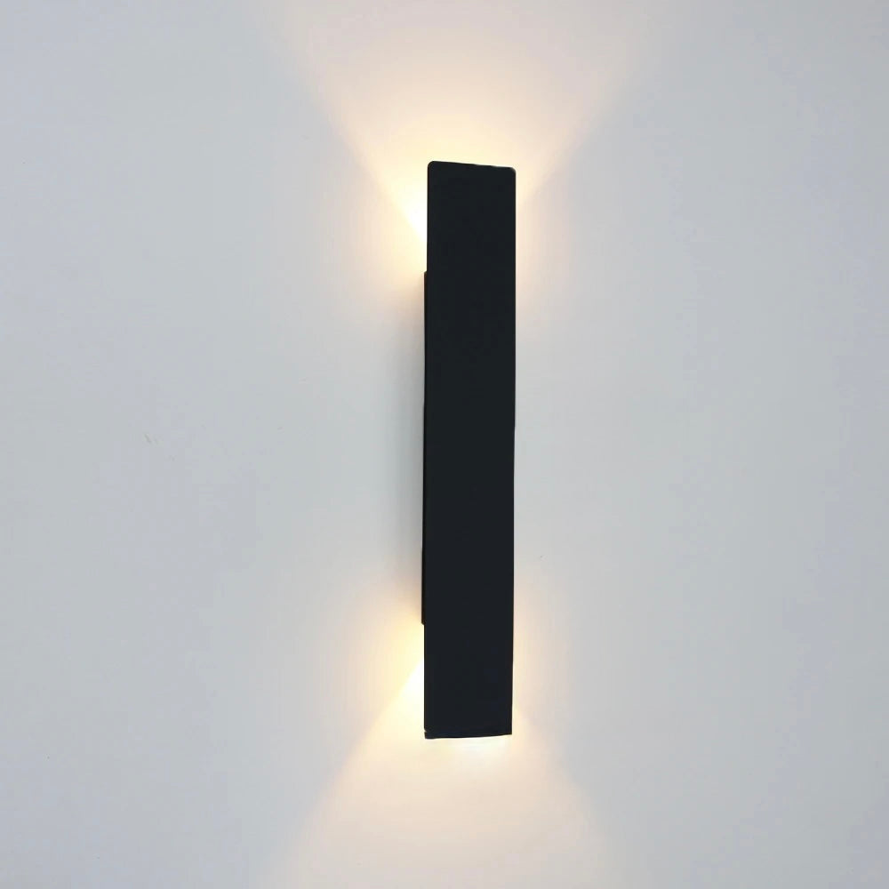 Black 18W modern wall light with elongated design for hallway or corridor lighting