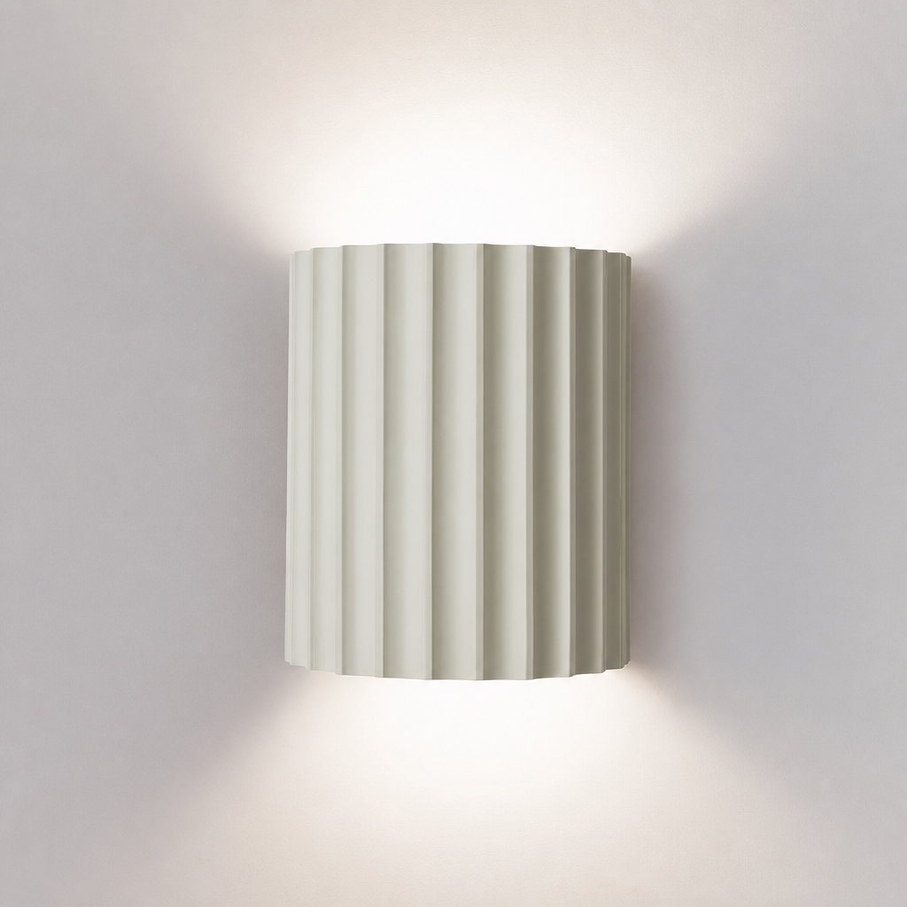 White ribbed resin wall lamp with smooth fluted texture.