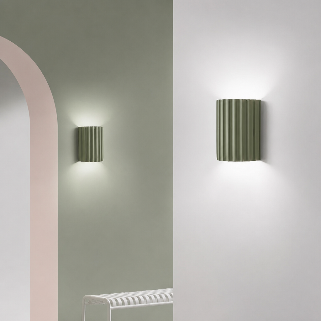 Sage green ribbed resin wall lamps with minimalist fluted design.
