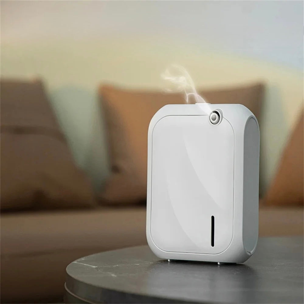 White humidifier emitting mist on a blurred indoor background