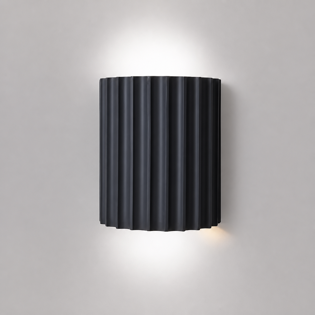Grey ribbed resin wall lamp with fluted half-cylinder shade.
