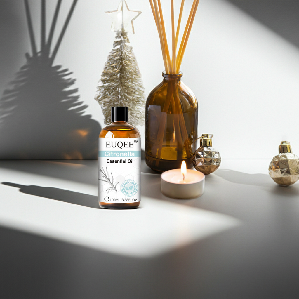 Citronella essential oil bottle on a surface with decorative items.