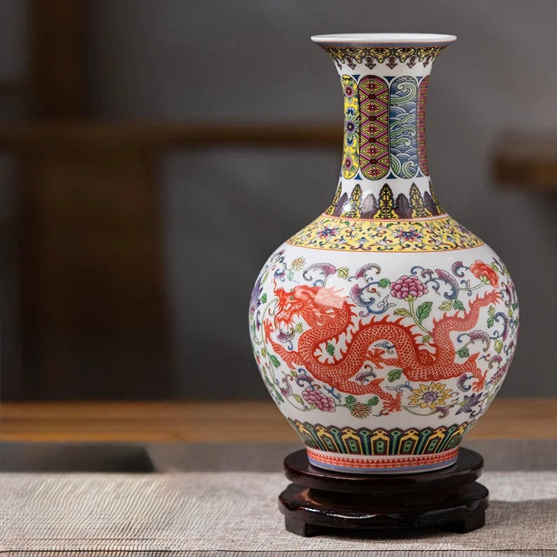 Flared-neck ceramic vase with a red dragon motif and yellow floral background.