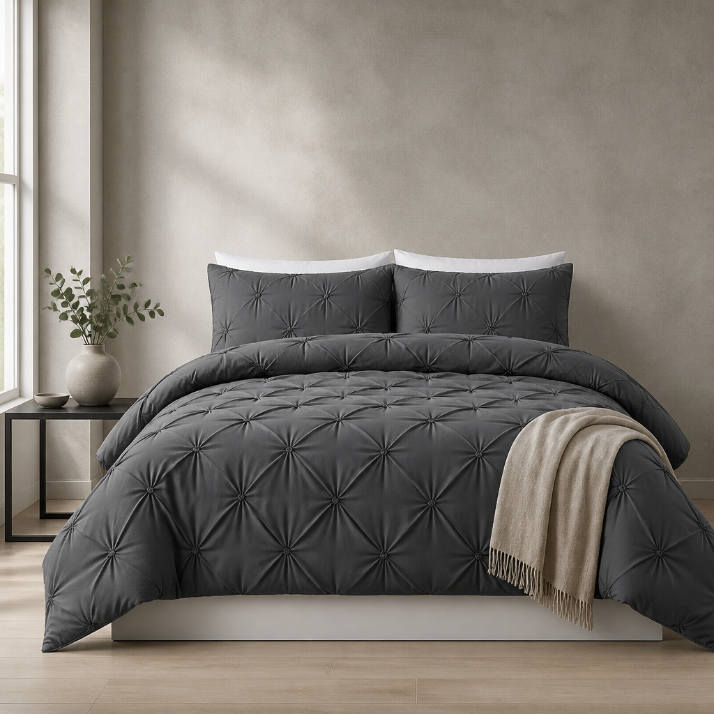 Charcoal pintuck duvet set with matching pillowcases dressed on a double bed in a clean modern bedroom
