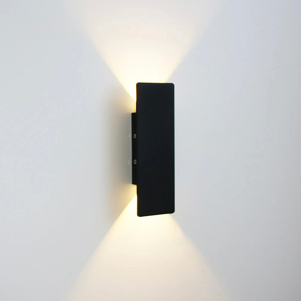 Black 6W compact rectangular wall light with minimalist finish and dual-direction glow