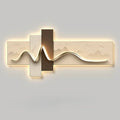 Modern wall light fixture with wavy design on a gray background