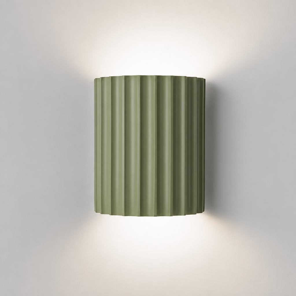 Sage green ribbed resin wall lamp with minimalist fluted design.