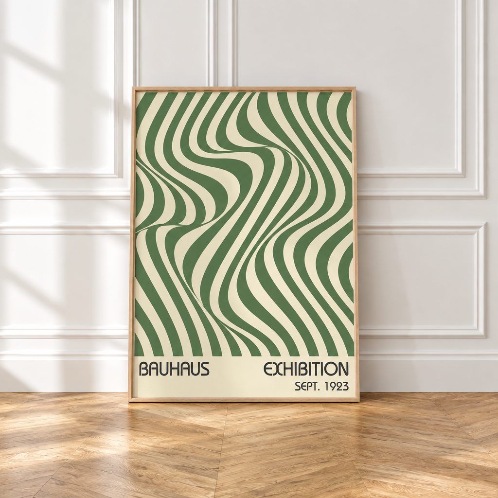 A framed Bauhaus exhibition poster from 1923 leaning against a white paneled wall on a wooden floor. The poster features a green and cream wavy optical illusion pattern with the text 'BAUHAUS EXHIBITION SEPT.