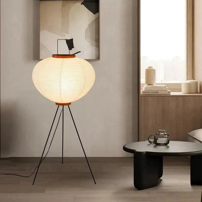 Large rice paper floor lamp on a black metal tripod base with wooden trim, 120cm tall and 53cm wide