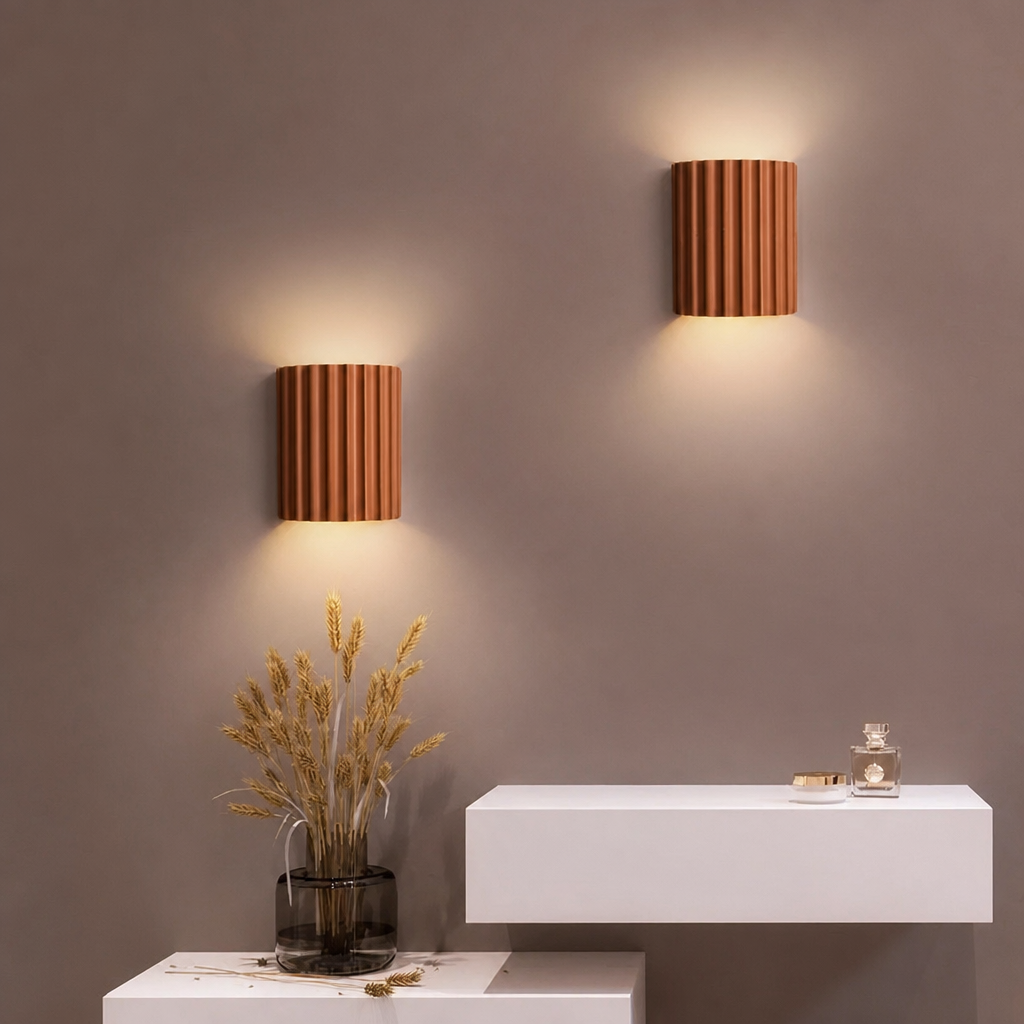 Orange ribbed resin wall lamps with warm-toned fluted shade.