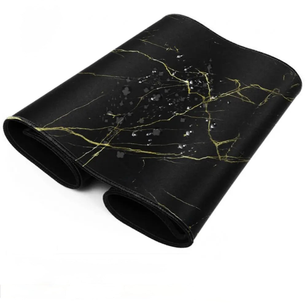 A black gaming mouse pad with a gold marble pattern, shown rolled up on a white background.