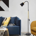 Black adjustable floor lamp in a contemporary living room setting