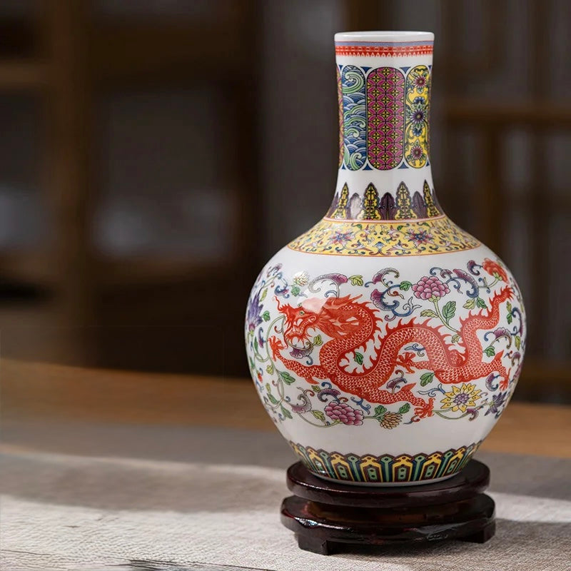 Tall-necked Chinese porcelain vase with a red dragon and colourful geometric patterns on the neck.