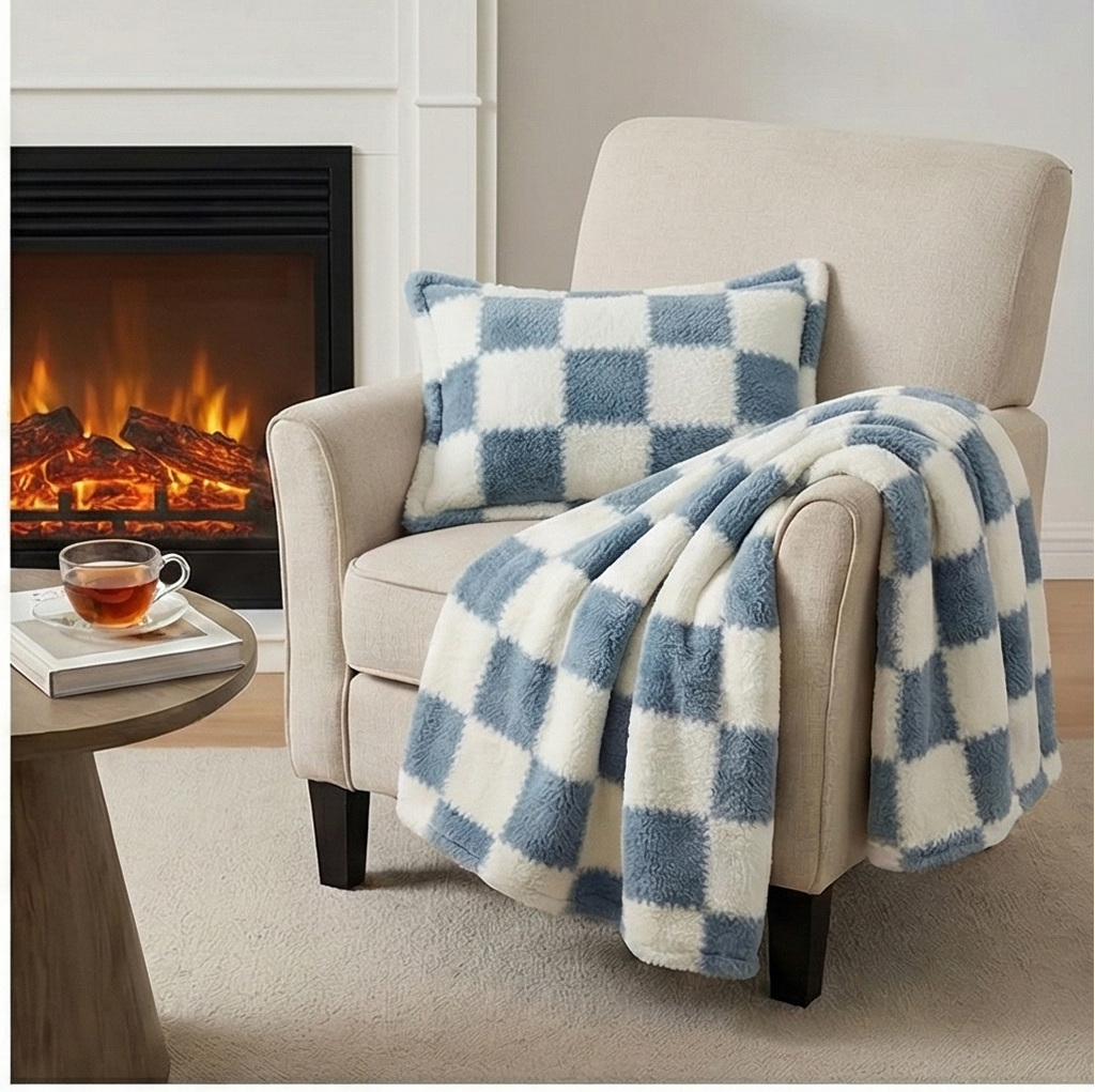 Checkered blue & white blanket and pillow on a chair.