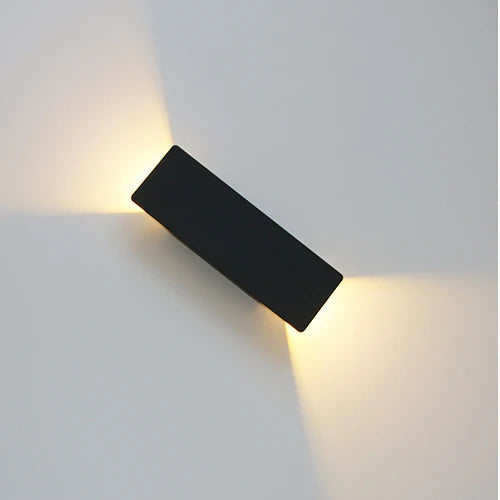 Black 6W compact rectangular wall light with minimalist finish and dual-direction glow