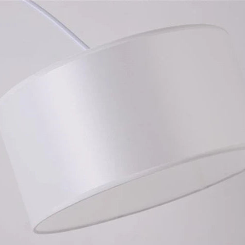 Close-up of the white fabric drum lampshade showing its texture.
