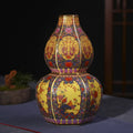 Decorative vase with intricate patterns on a dark background