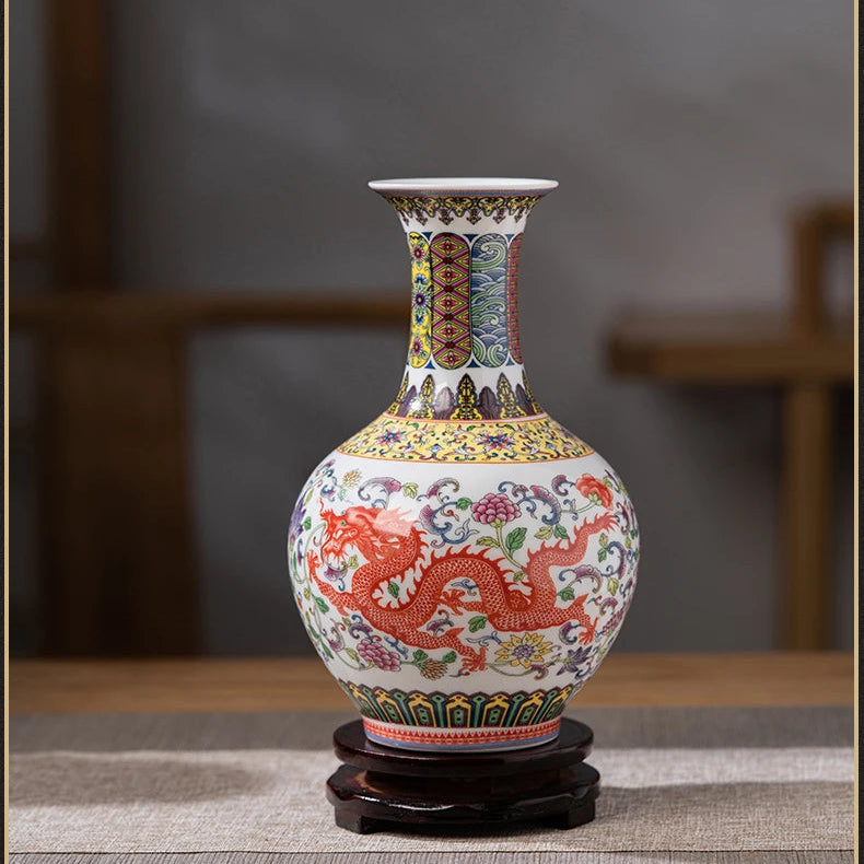 Flared-neck ceramic vase with a red dragon motif and yellow floral background.