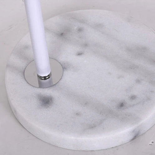 Close-up of the white marble-effect base with a clean grey vein pattern.