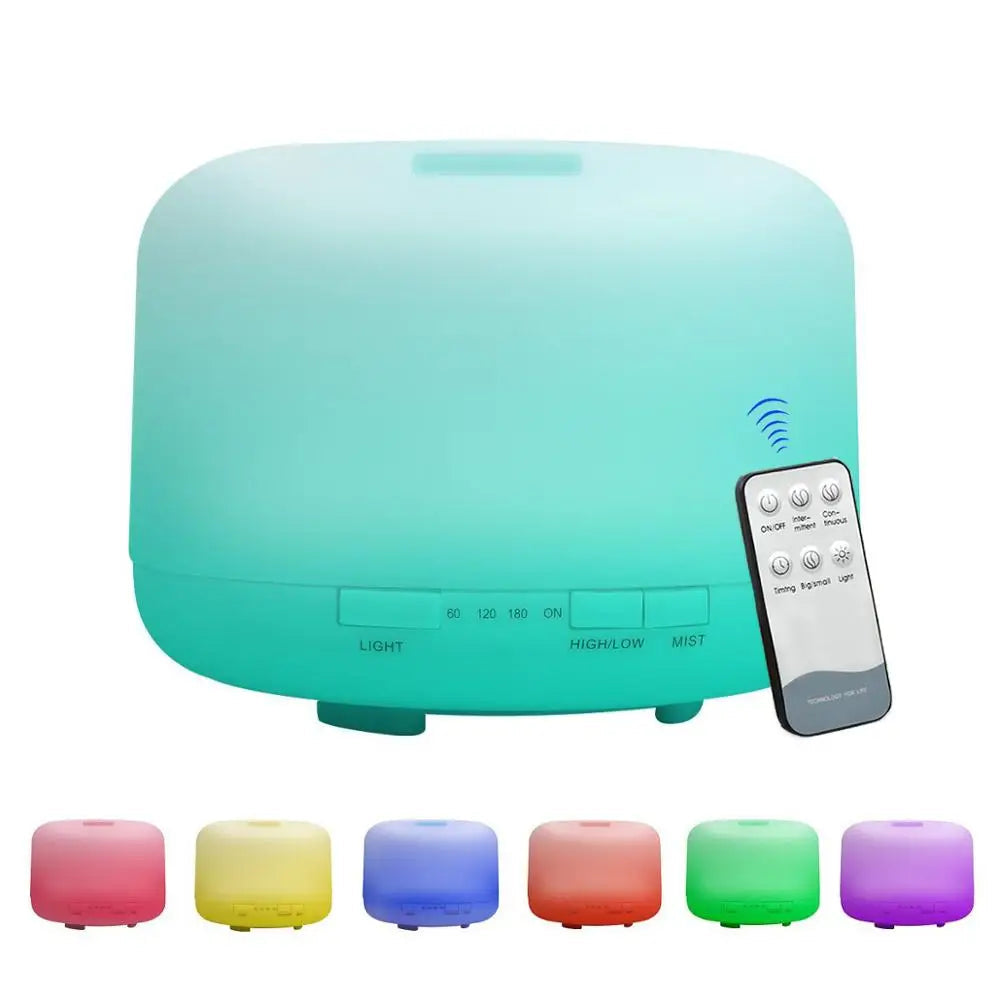 Turquoise essential oil diffuser with remote control and color-changing cubes on a white background