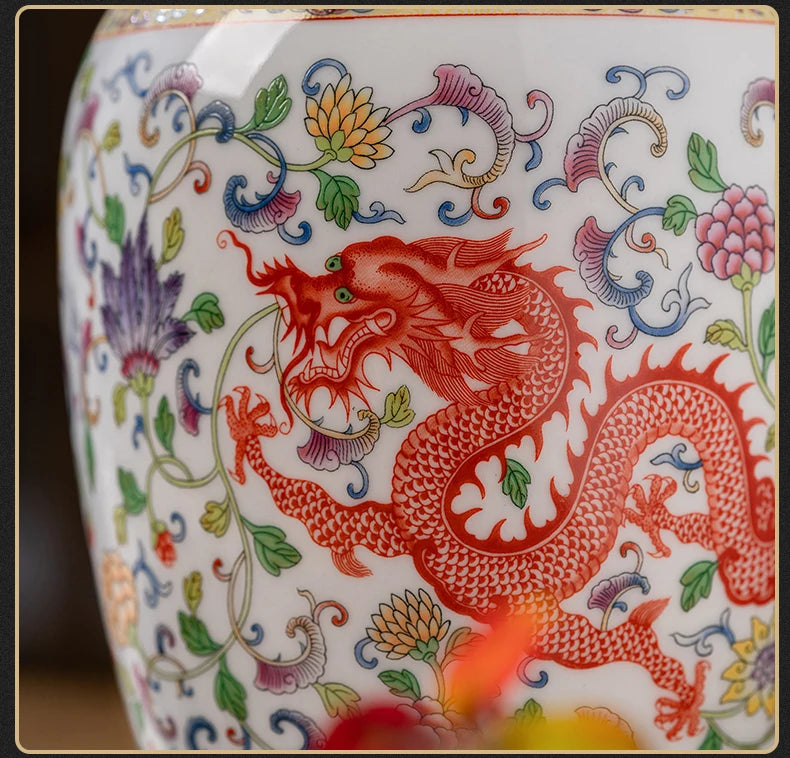Decorative ceramic vase with a red dragon and floral patterns on a white background