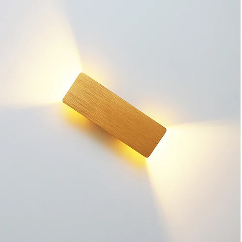 Gold 6W wall-mounted LED light with warm ambient up-and-down illumination