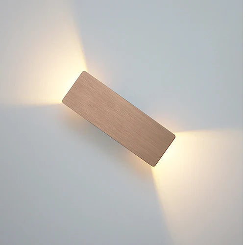 Gold 6W wall-mounted LED light with warm ambient up-and-down illumination