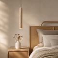 Bedroom with wooden headboard, nightstand, and pendant light fixture.