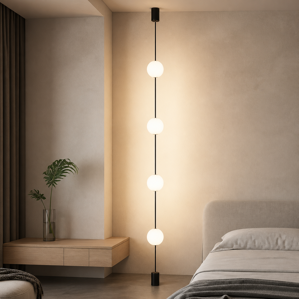 Modern neutral living room featuring a 4-head vertical globe floor light beside a curved sofa