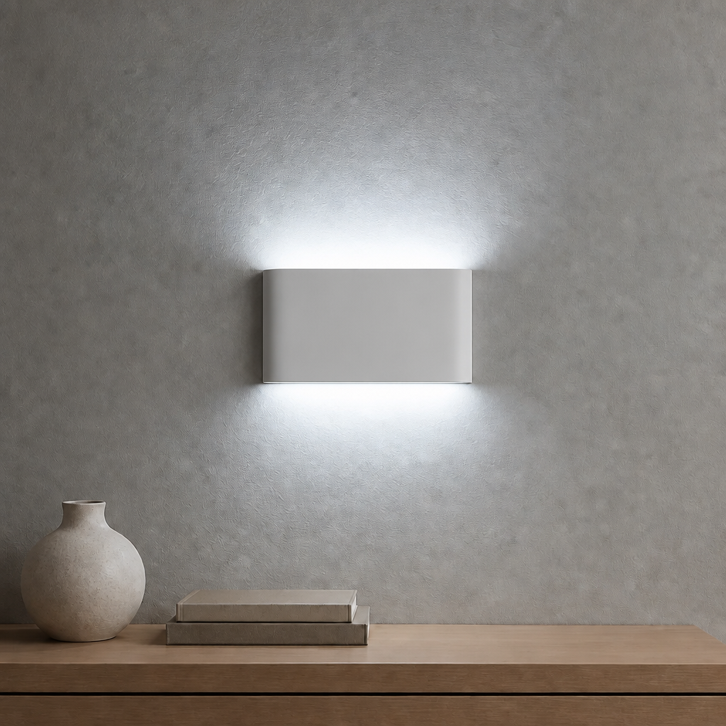 White 12W LED wall light casting a cool white glow upward and downward