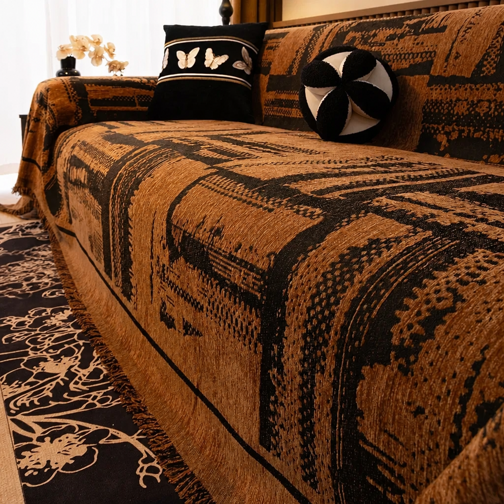 Brown chenille sofa cover with tribal block pattern styled on a sofa with decorative cushions