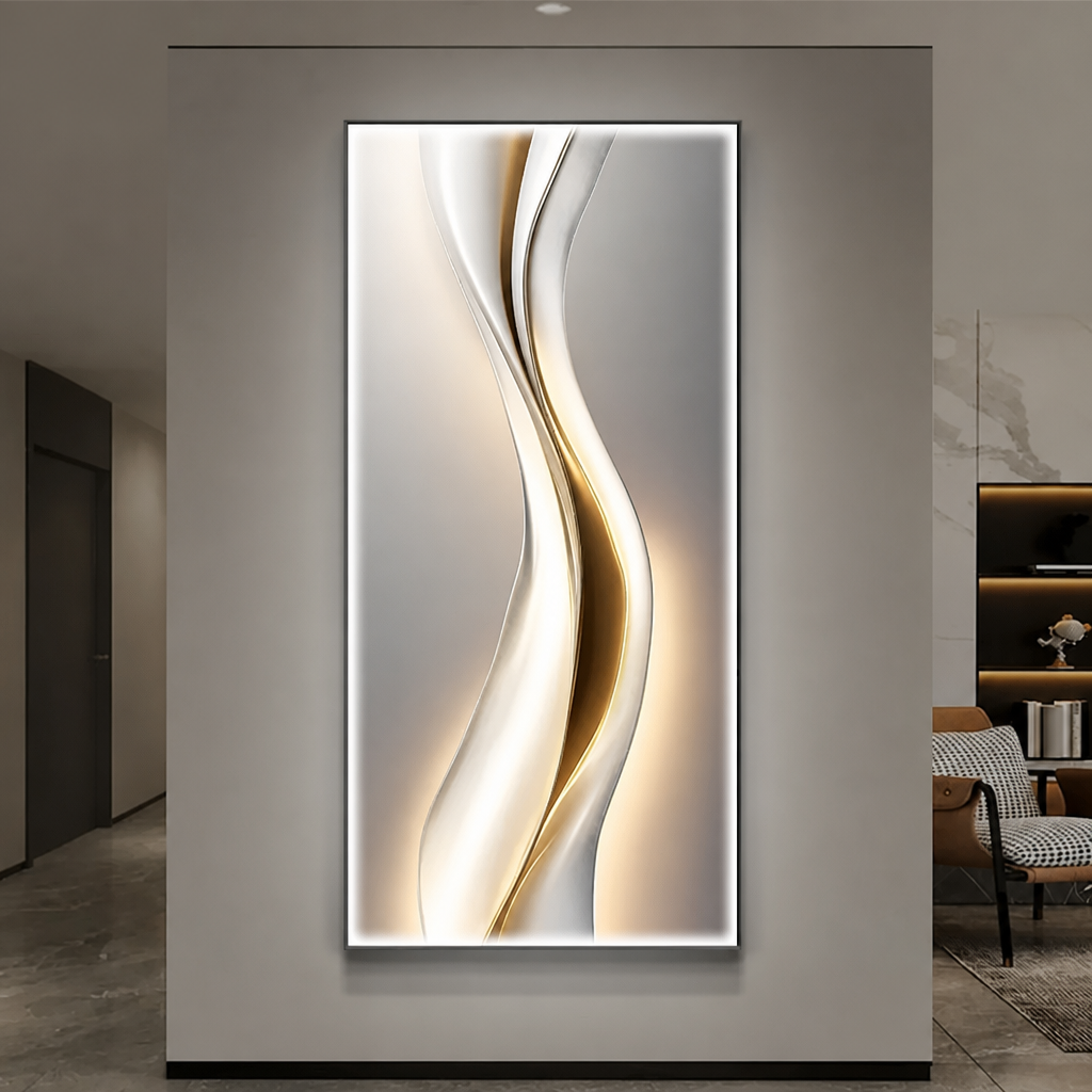 White and gold fluid wave LED wall art panel illuminated on a grey wall in a modern hallway