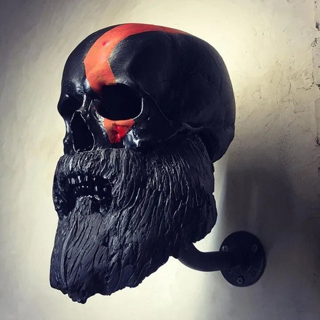 Black bearded skull decorative wall hanger with curved wall hook.