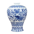 Blue and white ceramic vase with intricate patterns on a white background