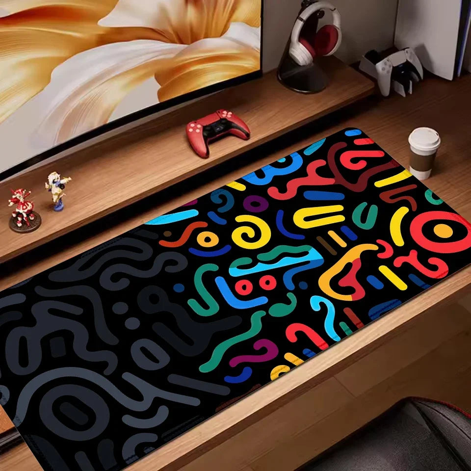Creative mouse pad with colourful abstract squiggle pattern on a black background