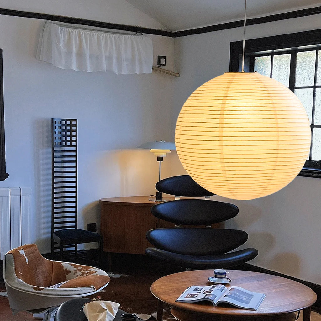 Living room with a round Japanese lampshade.