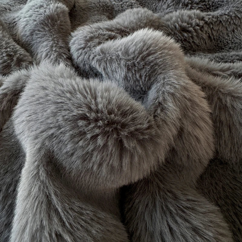 Close-up of a fluffy charcaol blanket