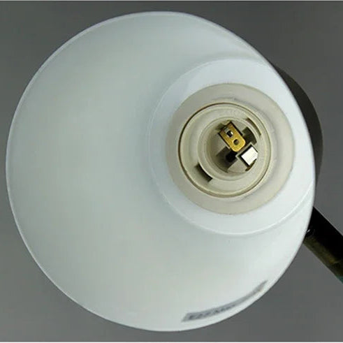Close-up of an E27 standard lamp holder on a white lampshade against a gray background.