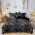 Charcoal grey skull print duvet cover set styled on a bed with matching pillowcases