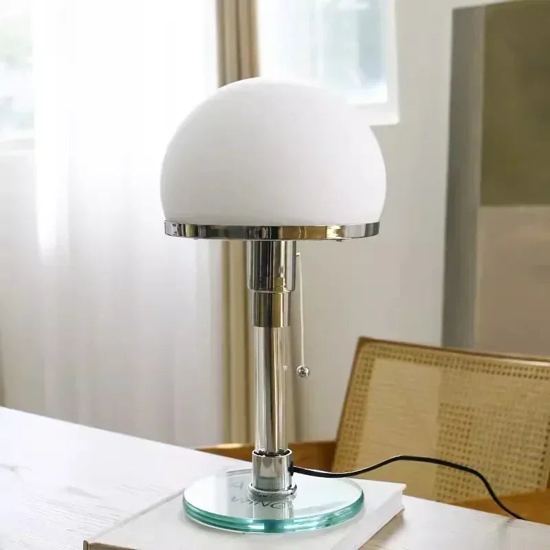 Mushroom table lamp with frosted glass shade and polished chrome body,