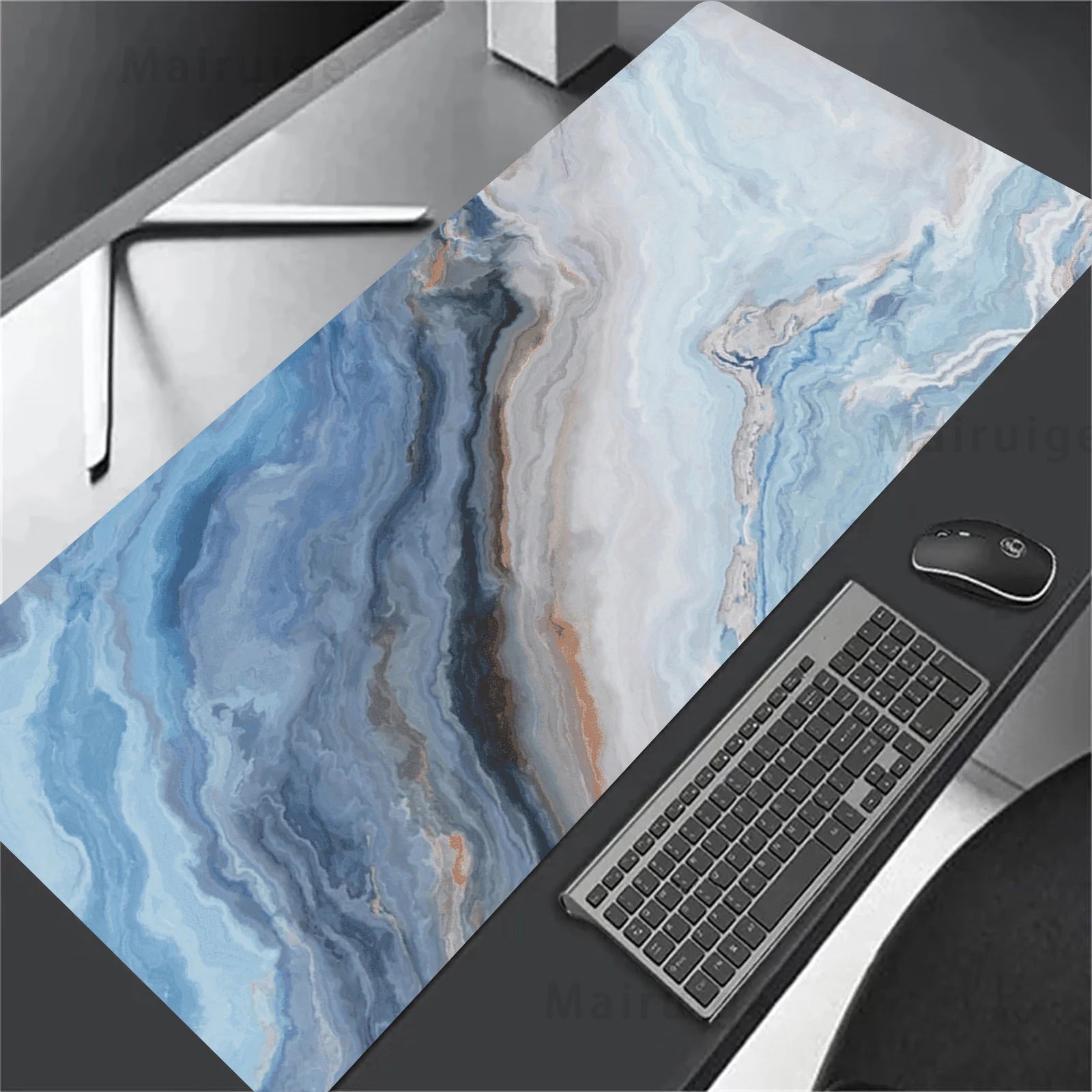 Marble-patterned desk mat with keyboard and mouse on a desk