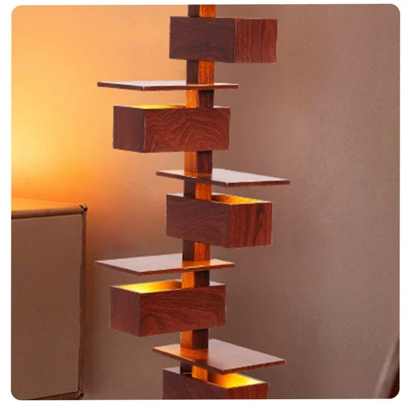 Close-up of illuminated rosewood grain lamp sections with warm internal glow and sculptural lines