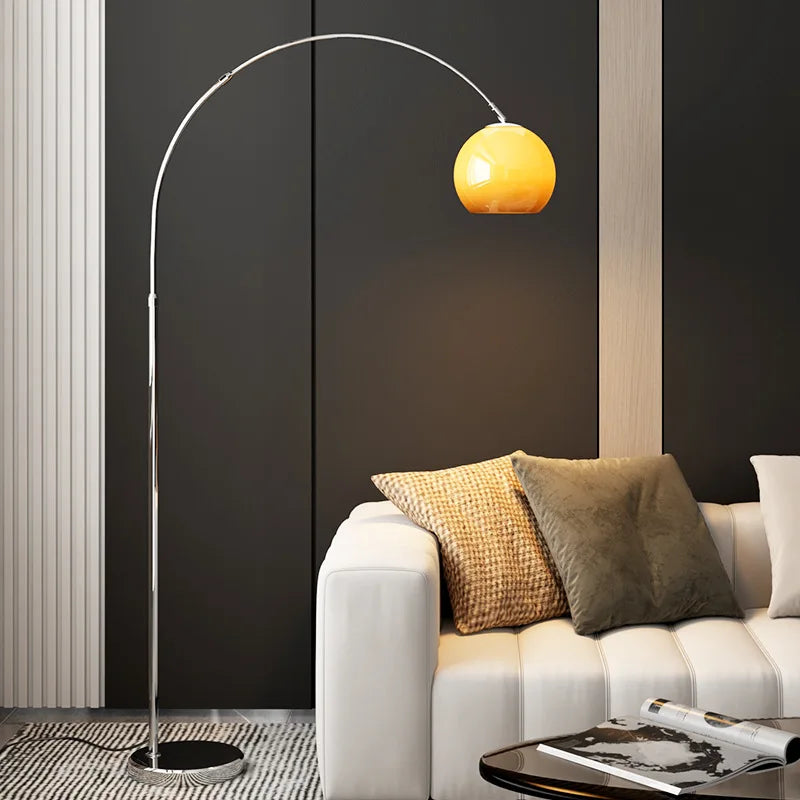Modern living room with an orange floor lamp.