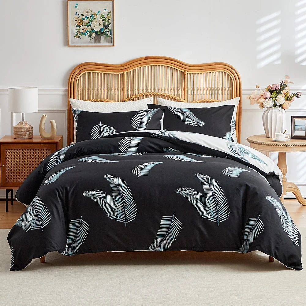 Black duvet cover set with white tropical palm leaf print and matching pillowcases
