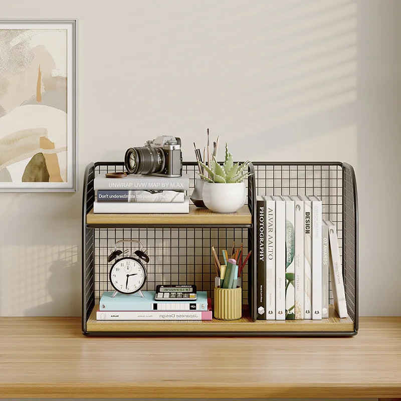 Small metal grid shelf with books, stationery, and a clock on a wooden surface.