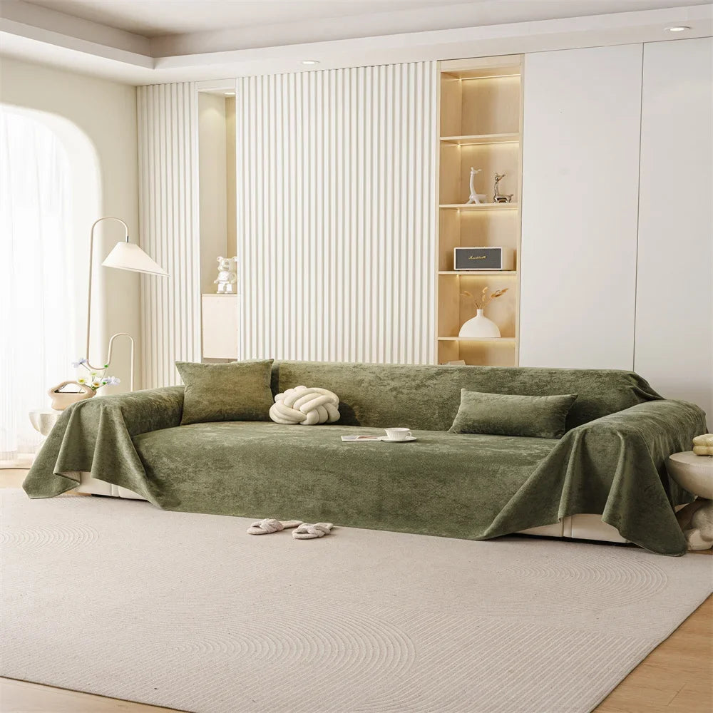 Olive green waterproof sofa throw draped over a modern two-seat sofa