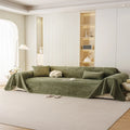 Olive green waterproof sofa throw draped over a modern two-seat sofa